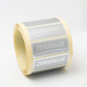 ET035-Rollo ETIQUETAS ZORIONAK FONDO PLATA IMPRESIÓN PELÍCULA PLATA 50 x 20mm. 500ud.